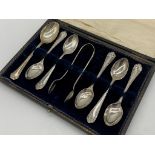 Cased early 20th century silver harlequin suite of six fancy teaspoons with sugar tongs, maker