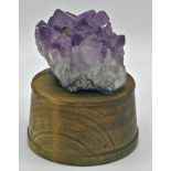 Amethyst crystal geode upon a turned treen plinth, possible pen holder, 18cm high