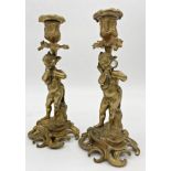 Good pair of late 19th century French cast ormolu figural candle sticks, the columns modelled as