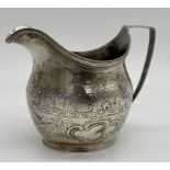 George III silver cream jug with later chased decoration, maker marks worn, London 1807, 11.5cm