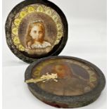 Pair of 19th century painted glass panels of a young boy and girl, within iron mounts, 15.5cm