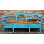 A Gustavian style painted pine hall bench, the raised back of serpentine form with ribbon mounts,