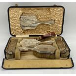 Edwardian silver six piece dressing set, comprising four brushes, comb and hand mirror, with