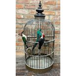 Exceptional cast copper wirework bird cage with simulated wood peckers and feather parrot, 100cm
