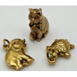 3 gold charms consisting of one 9ct charm in the form of a cat, weight 4.2 grams approx