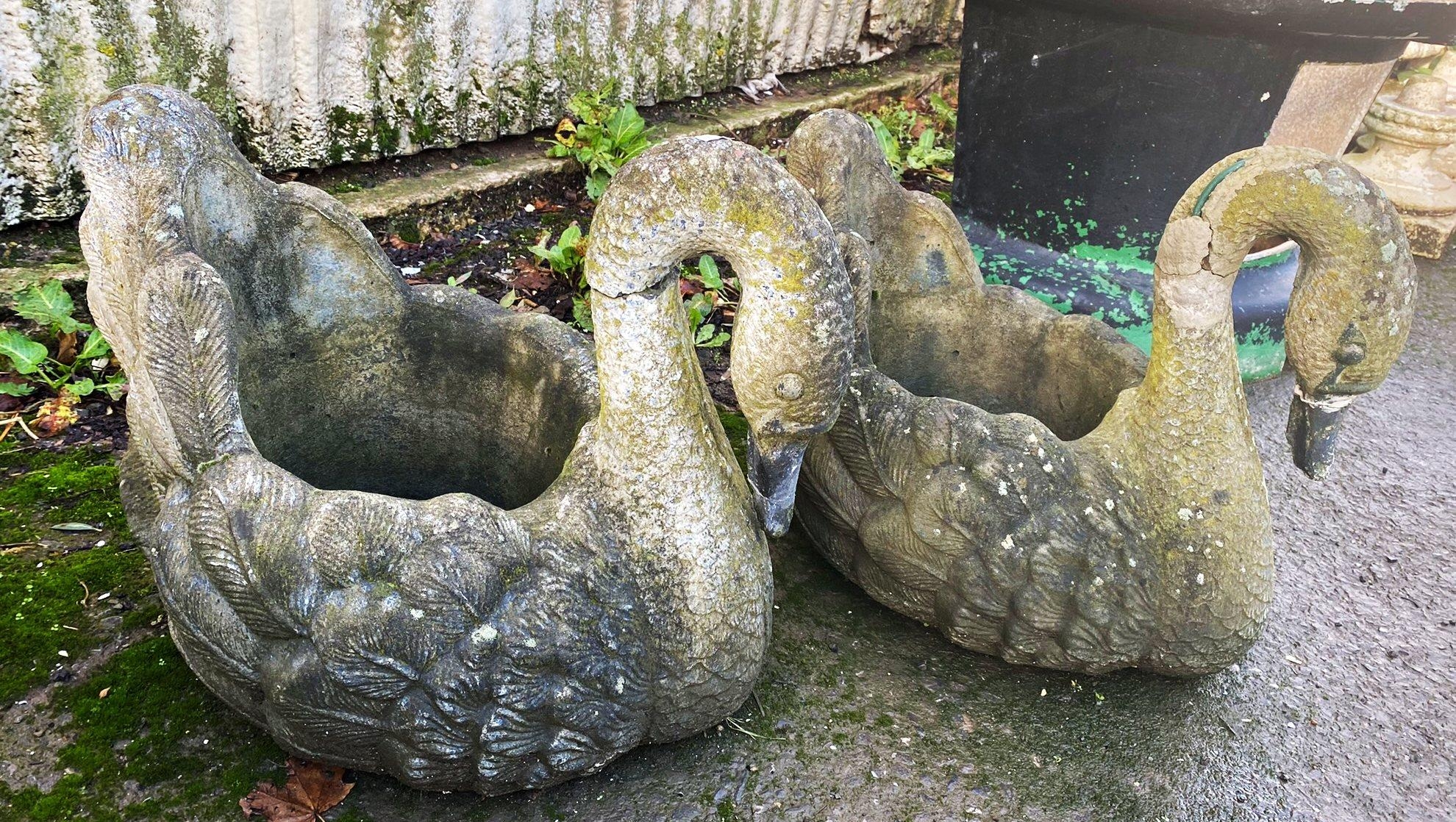 Pair of reconstituted stone planters in the form of swans, 48cm high x 55xm deep