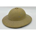 A vintage safari Pith helmet