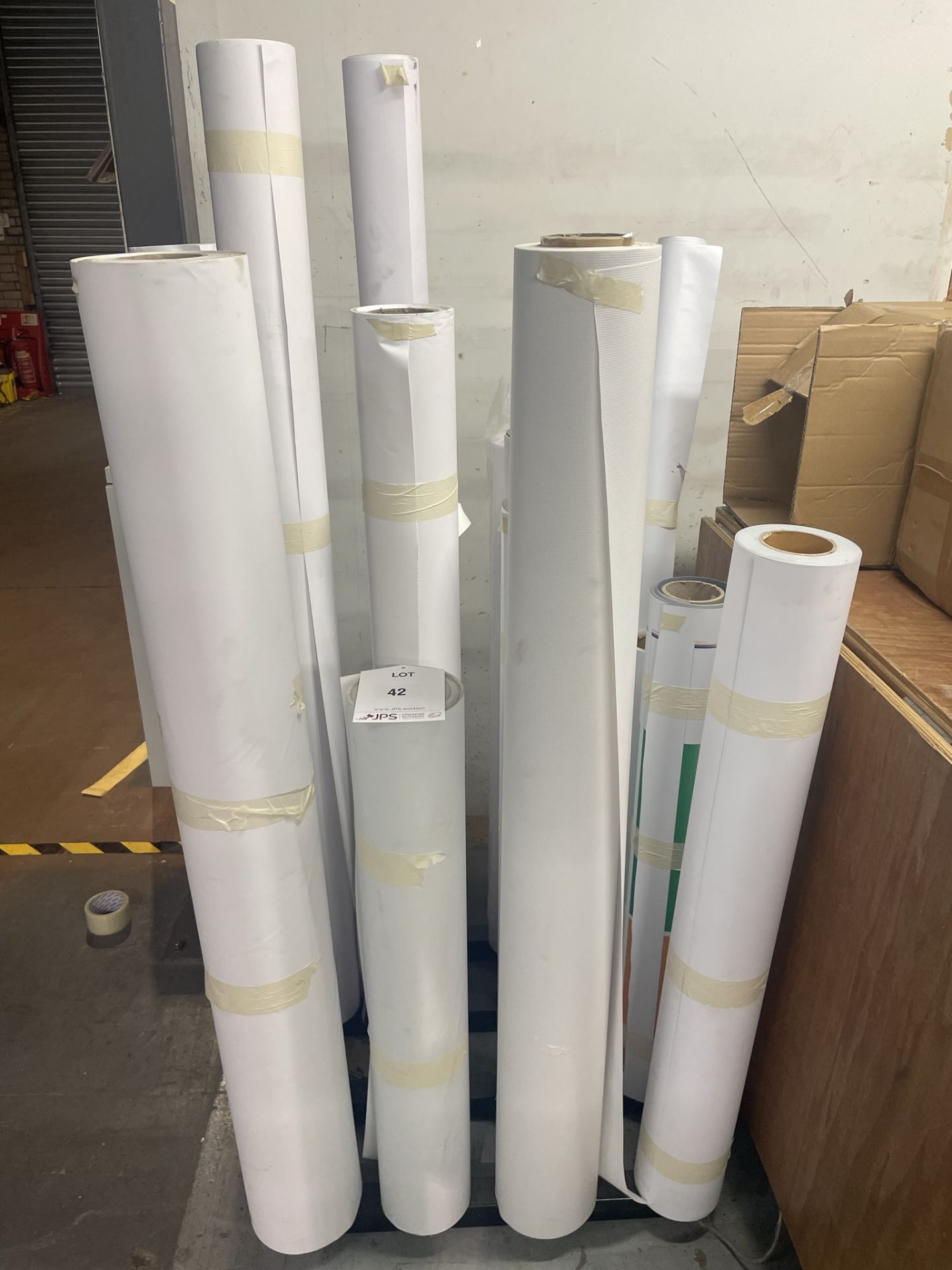 Quantity of Various Rolls of White Paper/Vinyl Stock - As Pictured w/ Display Stand