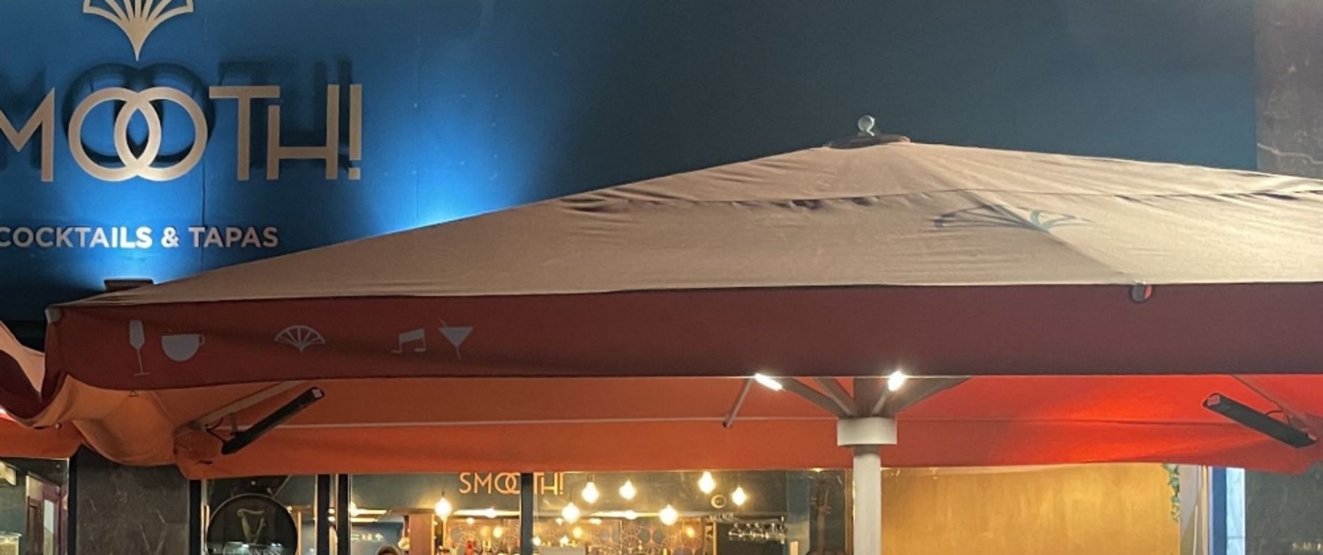 BRANDED ORANGE OUTDOOR PARASOL W/ BUILT IN LIGHTS AND HEATERS APPROXIMATELY