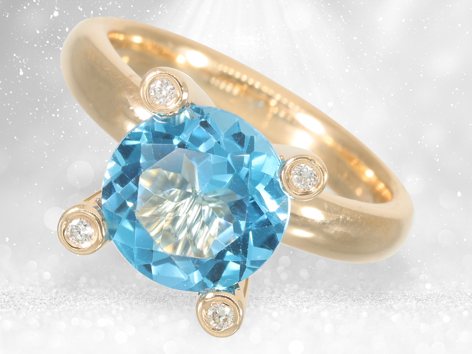 Fancy and decorative solid gold ring with beautiful blue topaz and brilliant-cut diamonds