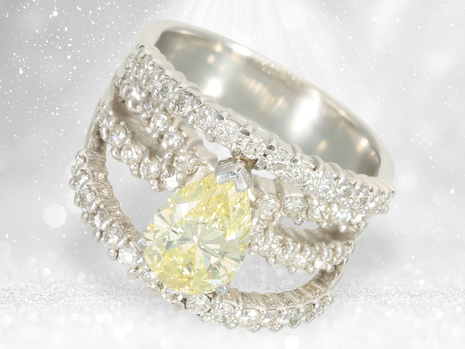 Ring: modern platinum designer ring with large Fancy Yellow diamond of 1.34ct, IGI certificate