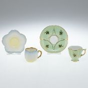 Blütentasse und passige Tasse mit Blättern. Manufacture de Porcelaines A. Lanternier & Cie, Limoges 