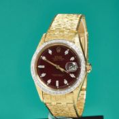 Rolex-Armbanduhr mit Brillanten und bordeauxfarbenem Zifferblatt