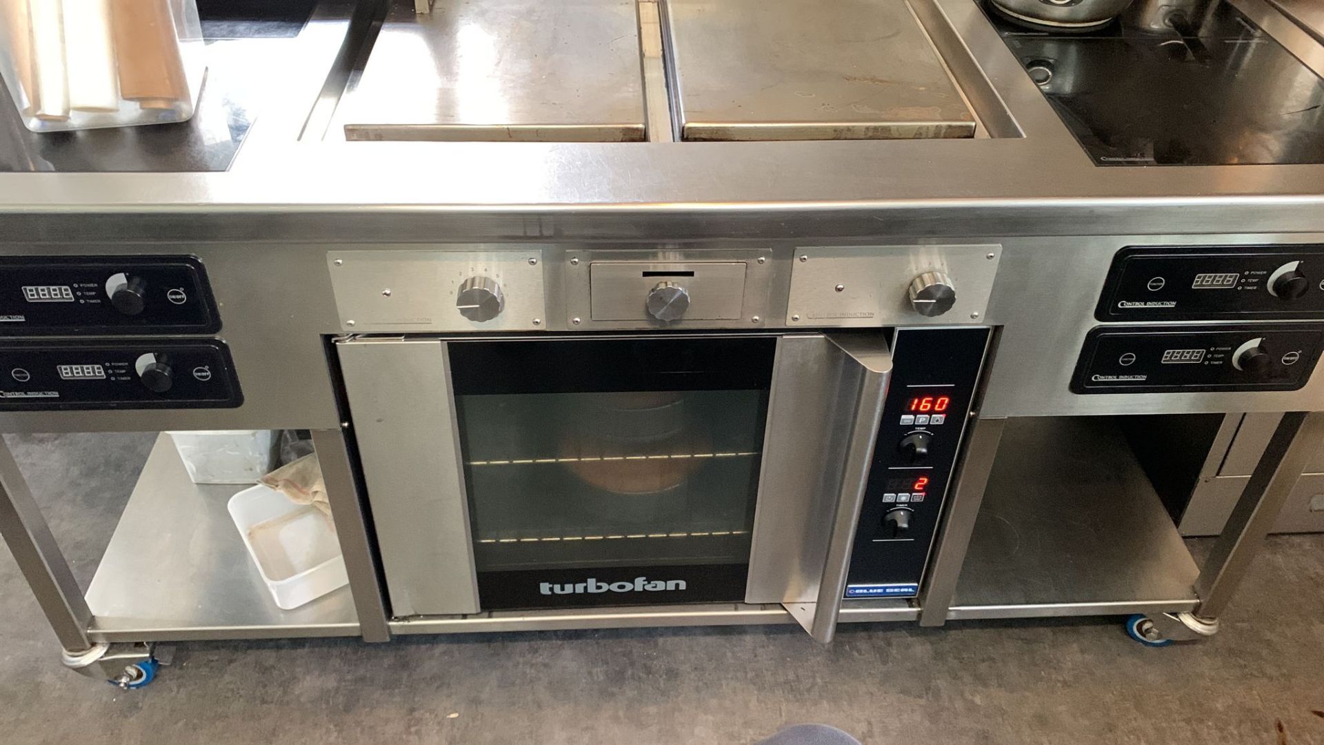 1 x Control Induction Suite 4 x induction hobs 2 x steel plancha, built in Blue Seal turbofan oven