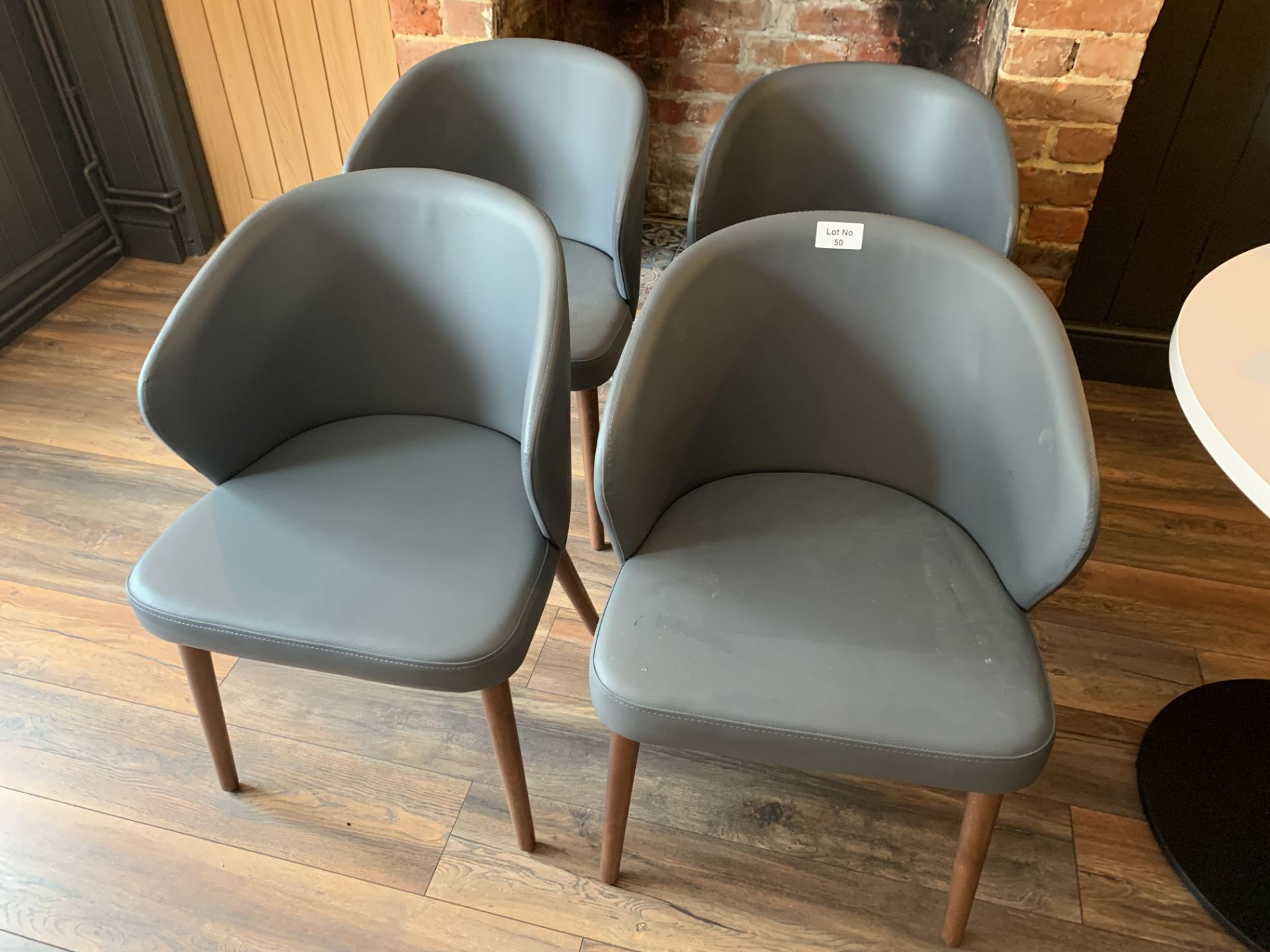 24 x grey leather style tub dining chairs