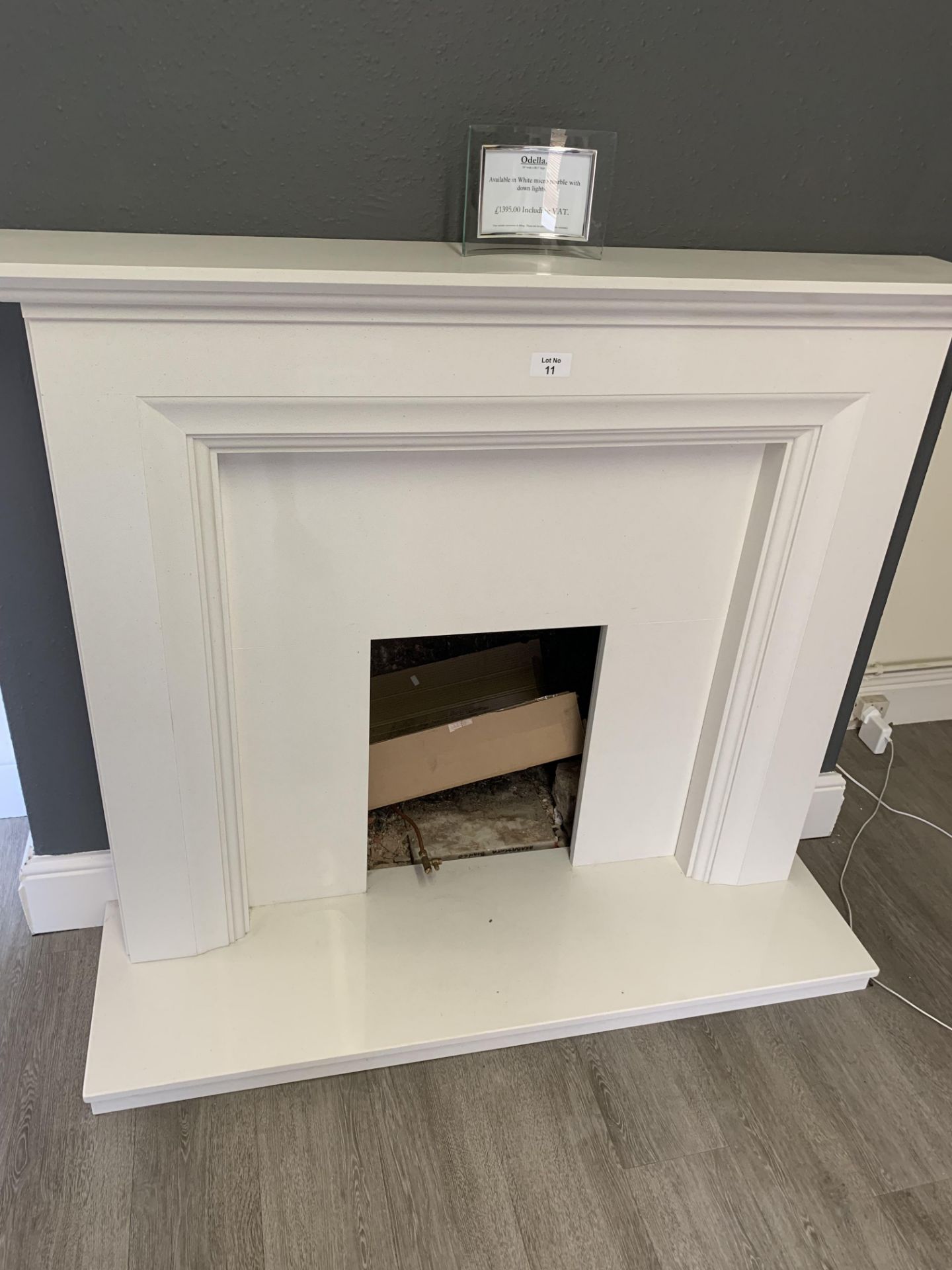 The Odella fire surround w 54 x h 48.5” with down lights