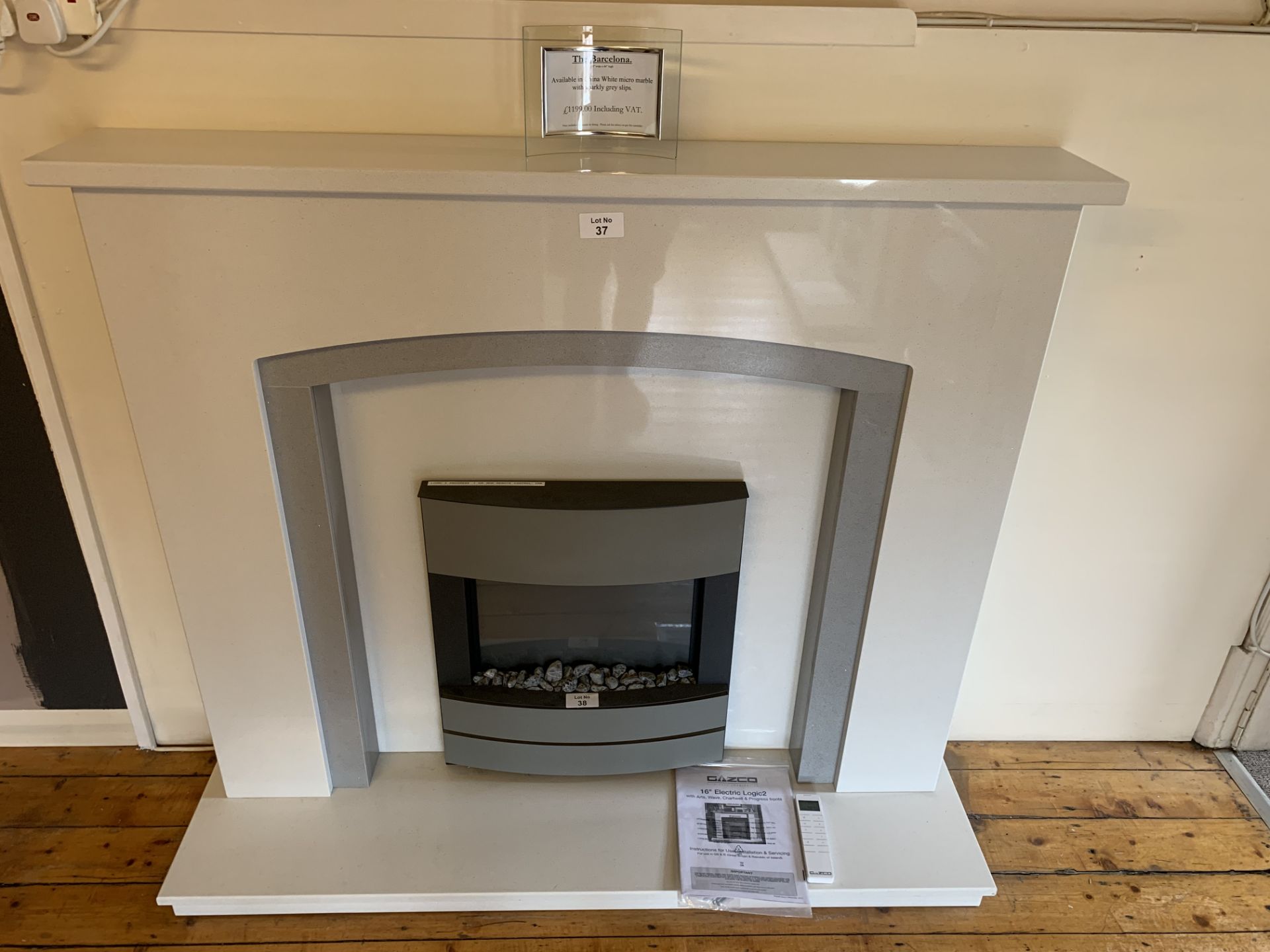 The Barcelona china white micro marble with sparkly grey slips w 54 x h 46” fire surround