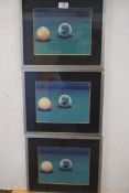 Three coloured prints, Crystal snooker ball, metal framed and glazed, 55cm wide