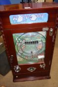 A vintage hardwood cased, coin operated "Hole in One" pinball machine