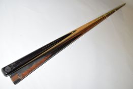 Two-piece cue together with a further single section cue marked '15 1/4 oz' (a/f), largest piece