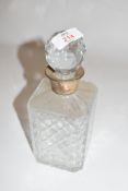 A cut clear glass octagonal decanter with silver hallmarked collar, Sheffield 1984, 24cm high