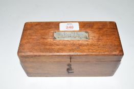 Small polished hardwood case containing three billiard balls, the case with small presentation