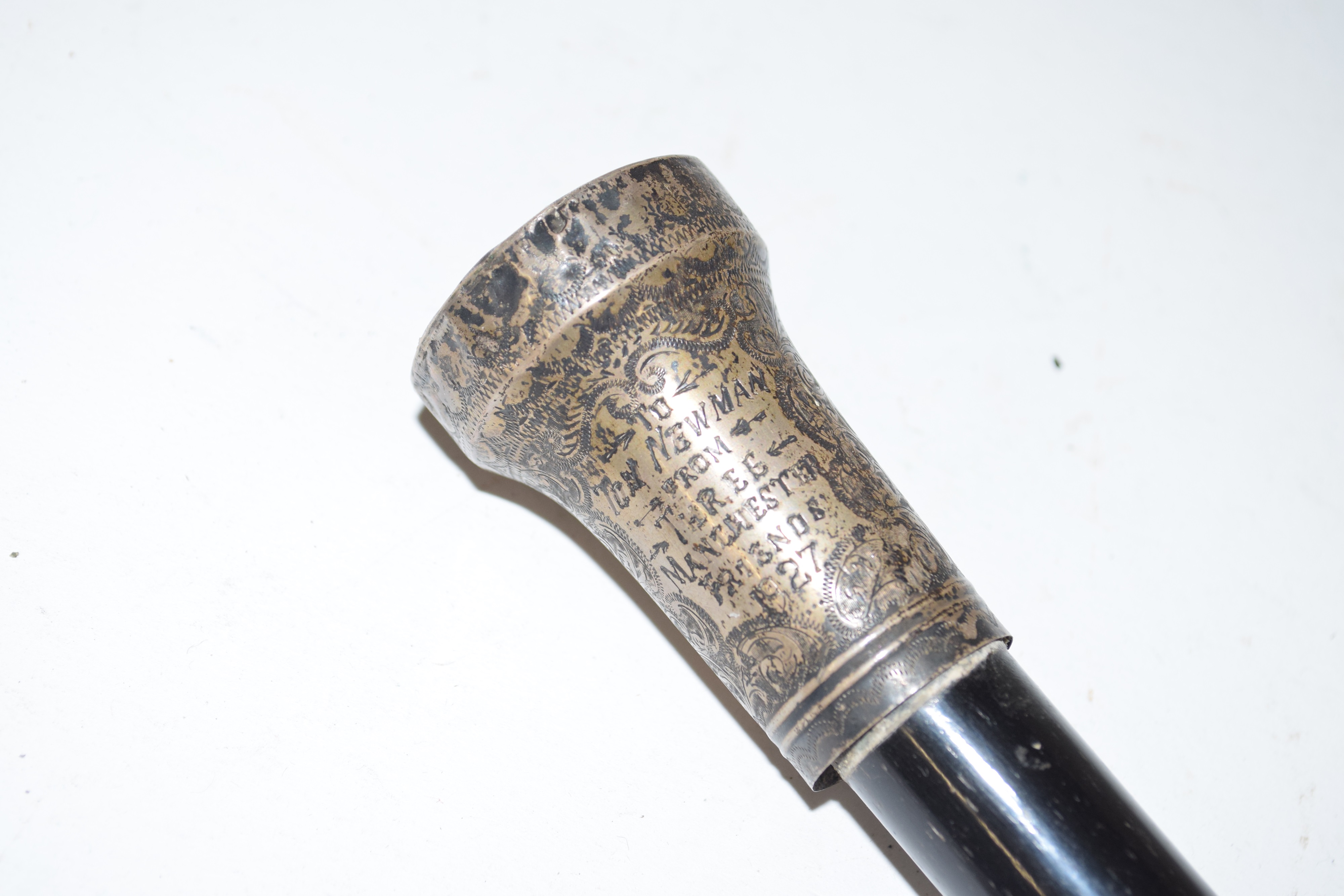 Ebonised and white metal mounted walking cane, the mount inscribed 'Tom Newman from three Manchester - Image 2 of 2