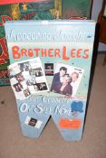Folding advertising board marked 'Appearing tonight Brother Lees', 110cm high