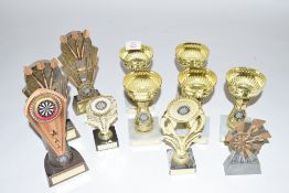 Group of eleven various small darts trophies, plastic/composition construction
