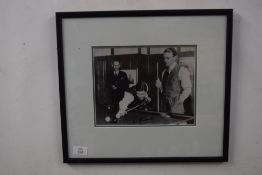 Black and white photograph of two billiards players, indistinctly signed, f/g, 43cm wide