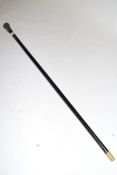 Ebonised and white metal mounted walking cane, the mount inscribed 'Tom Newman from three Manchester