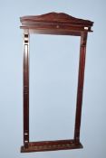 Mahogany snooker cue stand with shaped pediment and carved detail, 156cm high