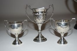 Group of three small silver trophies presented to Joyce Gardner