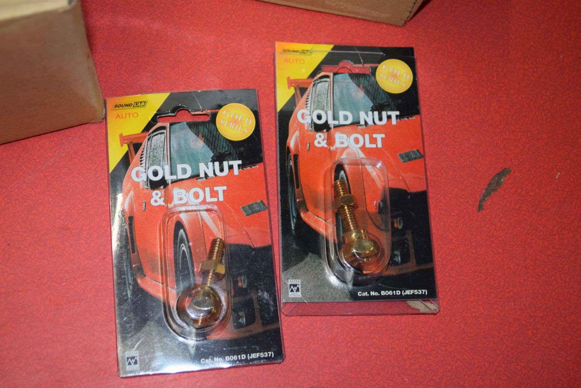 TWO BOXES CONTAINING SOUND LAB AUTO GOLD NUT AND BOLT CONNECTORS, APPROX 20 PIECES PER BOX