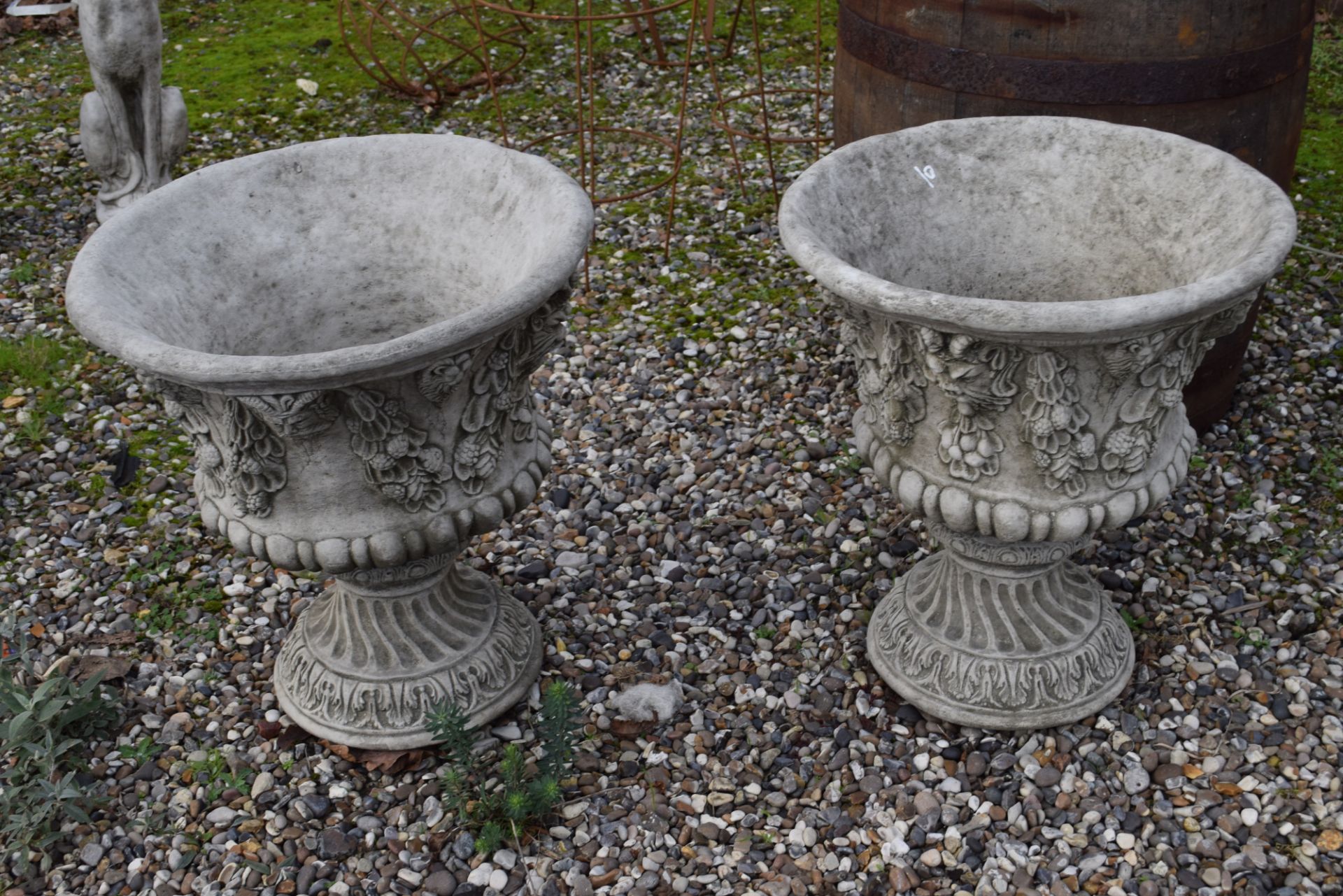 Pair of composite garden urns with ornate moulding, each height approx 58cm