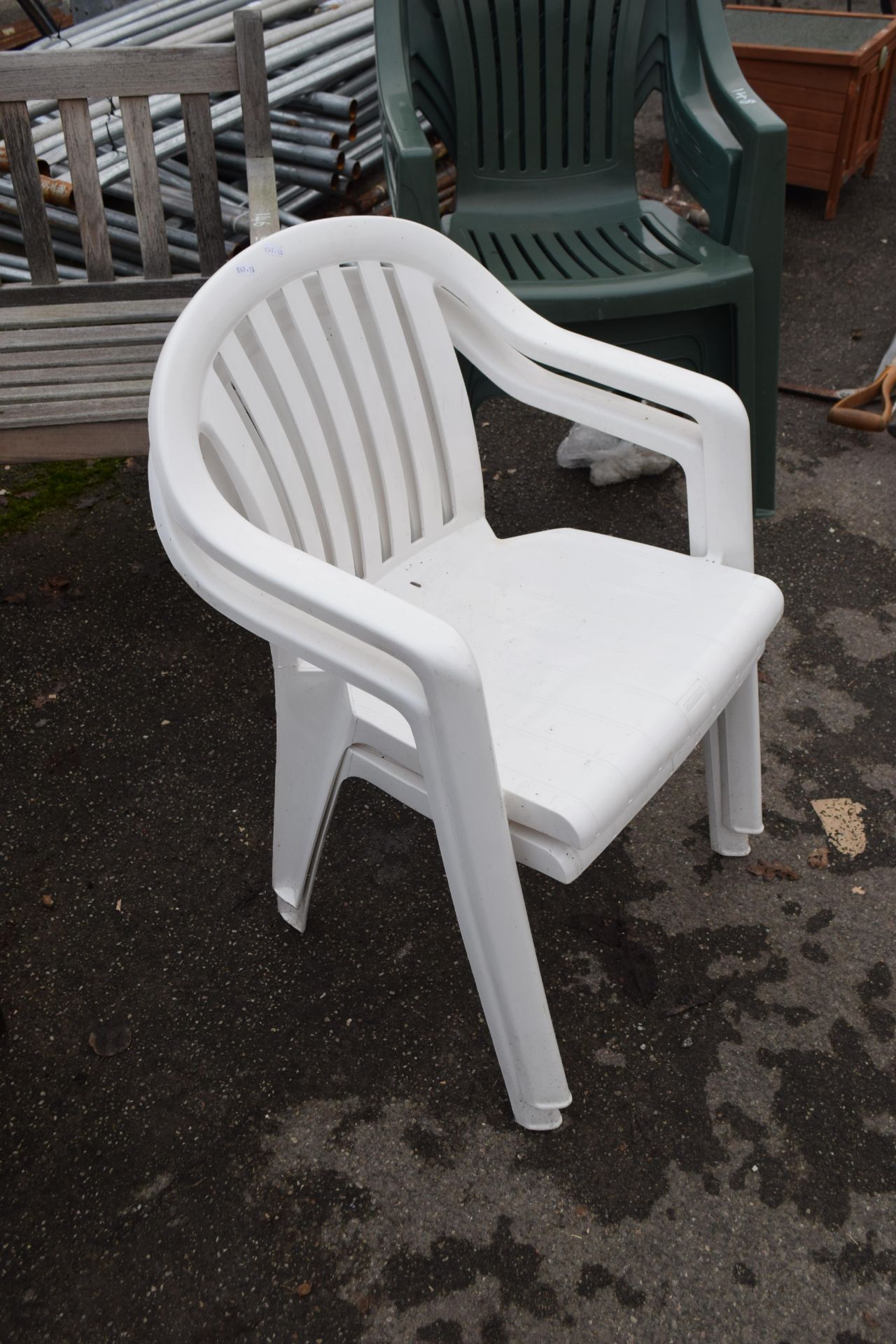 Pair of white plastic garden chairs