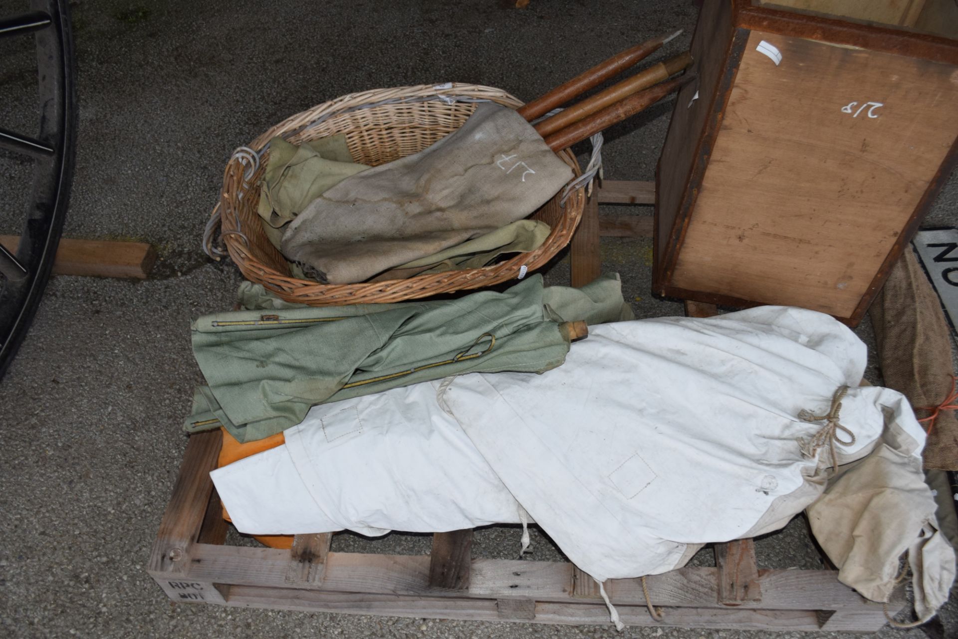 Quantity of canvas tarps and a wicker basket
