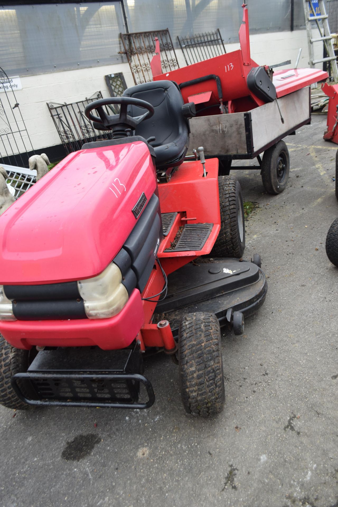Westwood ride-on lawnmower together with a cutting deck, grass collector and back box, and a
