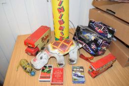 Box containing various mixed vintage toys to include a Walters Palm Toffee truck, a metal
