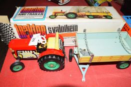Vintage Czechoslovakian metal clockwork tractor and trailer with original box