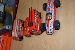 Mixed Lot : two tin plate model buses, a further metal racing car, possibly Japanese, and a Schuco