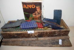Small wooden case containing Meccano construction items and booklet