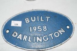 Oval cast iron plaque marked 'Built Darlington 1958', 27cm wide