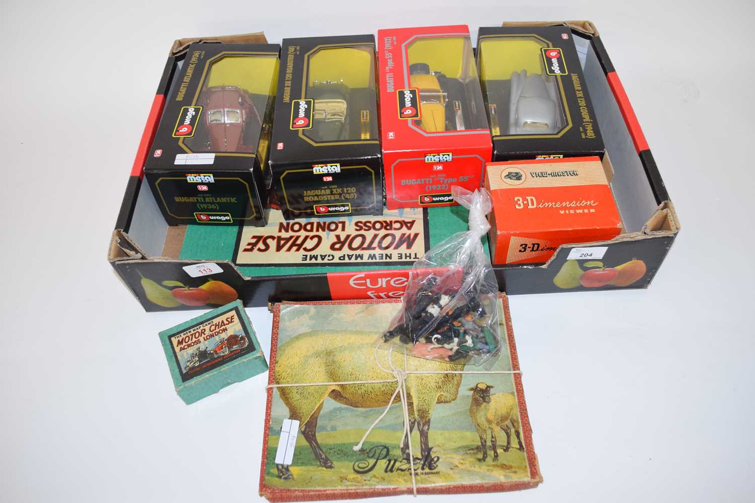 Mixed Lot comprising four boxed Burago Collectors toy cars to include Bugatti and Jaguar, together