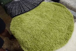 Tufted green floor rug, width approx 70cm