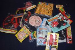 A box of various Beano and Dandy toys/gifts