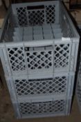 Three crates containing approximately eighty high ball glasses