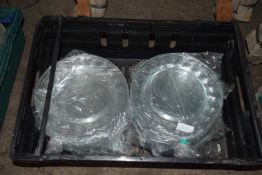 Approximately fifty, 9 inch glass serving plates