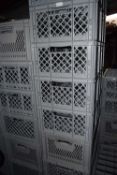 Twenty four grey stacking storage/transit crates for glass ware