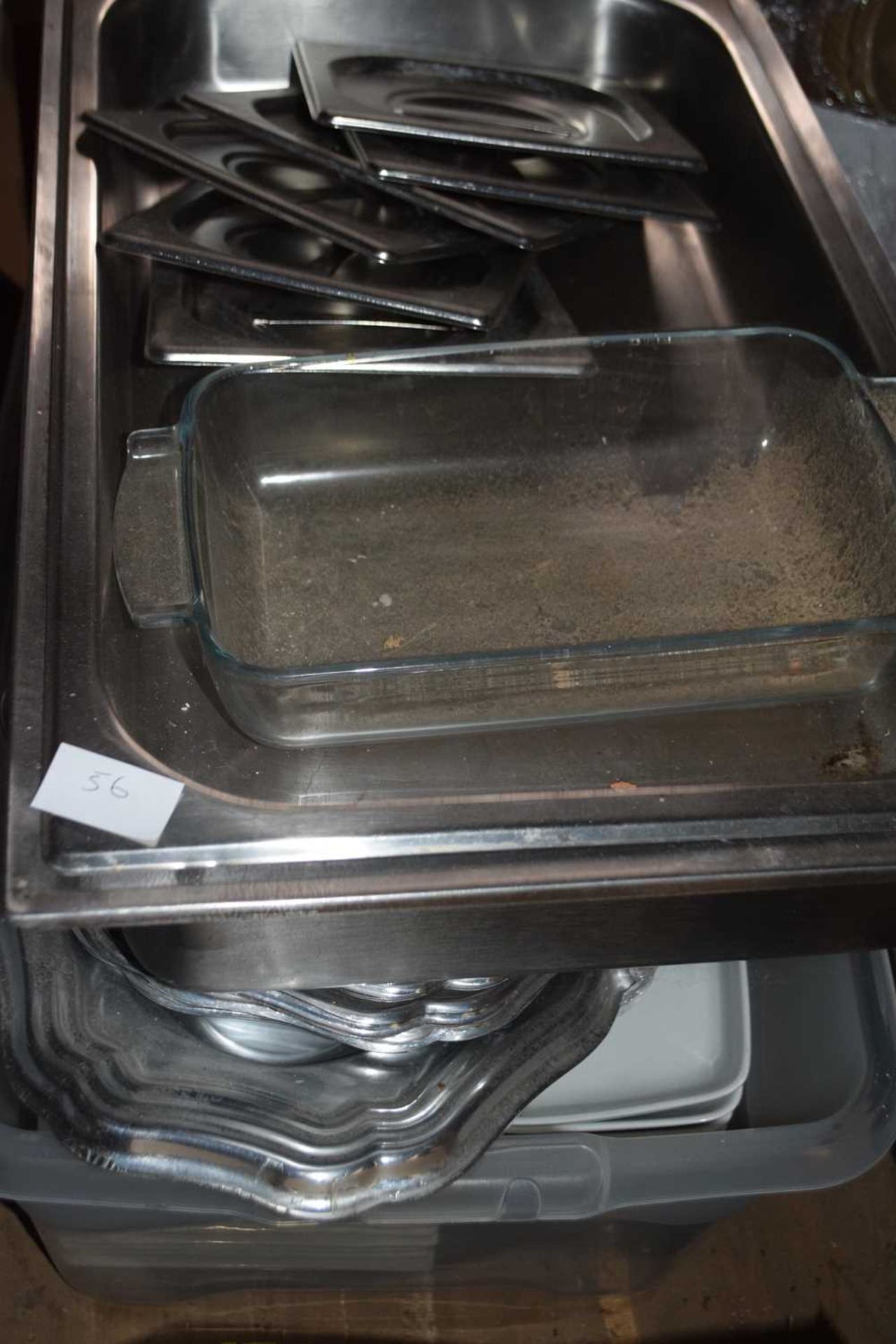 Box containing a mixed quantity of stainless steel and paper serving plates and dishes